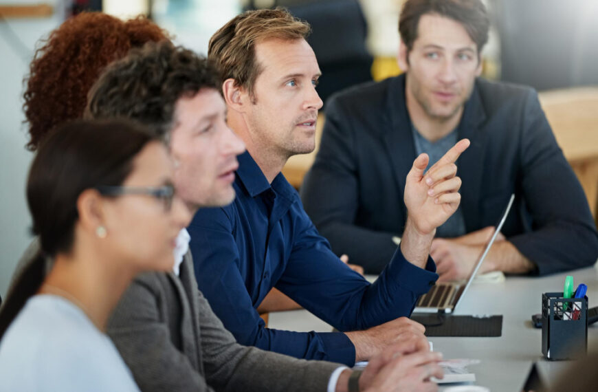 A group of professional employees attending team training